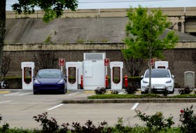 Tesla electric vehicles (EVs) fast-charge using Tesla Superchargers at a Buc-ee’s travel center and gas station in Baytown, Texas, U.S., March 18, 2023.