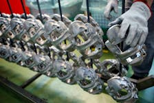 A technician works on brake disc components in the Brembo factory in Curno, Italy June 19, 2017. Picture taken June 19, 2017.   