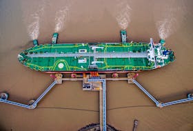 An oil tanker unloads crude oil at a crude oil terminal in Zhoushan, Zhejiang province, China July 4, 2018.