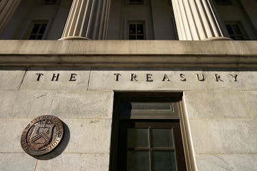 A view shows a bronze seal beside a door at the U.S. Treasury building in Washington, U.S., January 20, 2023. 