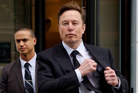 Tesla CEO Elon Musk and his security detail depart the company?s local office in Washington, U.S. January 27, 2023. 