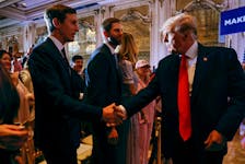 Former U.S. President Donald Trump shakes hands with his son-in-law Jared Kushner in front of his son Eric after Trump announced that he will once again run for U.S. president in the 2024 U.S. presidential election during an event at his Mar-a-Lago estate in Palm Beach, Florida, U.S. November 15, 2022.