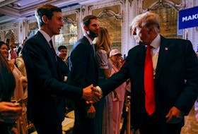 Former U.S. President Donald Trump shakes hands with his son-in-law Jared Kushner in front of his son Eric after Trump announced that he will once again run for U.S. president in the 2024 U.S. presidential election during an event at his Mar-a-Lago estate in Palm Beach, Florida, U.S. November 15, 2022.