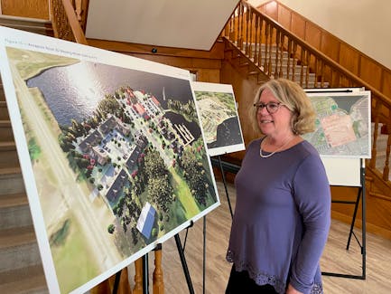 Annapolis Basin Conference Centre chief executive officer Beth Earle looks over design concepts of what Cornwallis Park and Annapolis Royal could look like if ideas in a master plan are implemented.
Jason Malloy