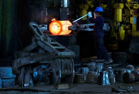 An employee moves forging red hot steel inside the ArcVac ForgeCast factory, in Hooghly district, in the eastern state of West Bengal, India, April 26, 2024.
