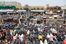Motorcycles are parked near an unfinished bridge in the old Fagge district in Kano, Nigeria, August 26, 2017.