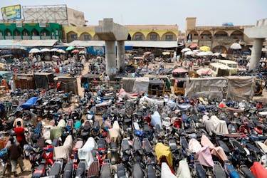 Motorcycles are parked near an unfinished bridge in the old Fagge district in Kano, Nigeria, August 26, 2017.