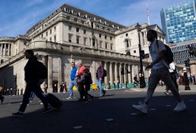People walk past the Bank of England building, in London, Britain, May 8, 2024.
