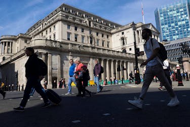 People walk past the Bank of England building, in London, Britain, May 8, 2024.