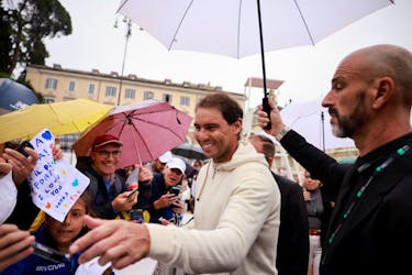 Tennis - Rafael Nadal meets fans ahead of the Italian Open - Piazza del Popolo, Rome, Italy - May 8, 2024 Rafael Nadal signs autographs for fans 