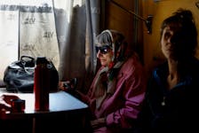 Valentyna Sharonova, 88-year-old and her daughter Anzhelika, 57-year-old, sit inside a train in the Pokrovsk town after they were evacuated by volunteers of the EastSOS non-government organisation from the frontline town of Toretsk, amid Russia's attack on Ukraine, in Donetsk region, Ukraine May 8, 2024.