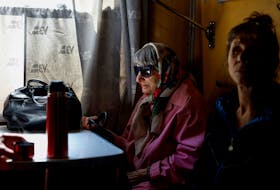 Valentyna Sharonova, 88-year-old and her daughter Anzhelika, 57-year-old, sit inside a train in the Pokrovsk town after they were evacuated by volunteers of the EastSOS non-government organisation from the frontline town of Toretsk, amid Russia's attack on Ukraine, in Donetsk region, Ukraine May 8, 2024.