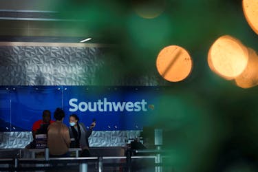 Southwest customers visit the help desk after U.S. airlines, led by Southwest, canceled thousands of flights due to a massive winter storm which swept over much of the country before and during the Christmas holiday weekend, at Dallas Love Field Airport in Dallas, Texas, U.S., December 28, 2022. 