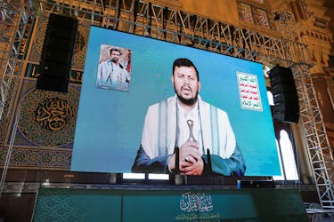 Houthi leader Abdul-Malik al-Houthi addresses followers via a video link at the al-Shaab Mosque, formerly al-Saleh Mosque, in Sanaa, Yemen February 6, 2024.