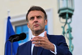 French President Emmanuel Macron speaks to reporters on the day of a joint Franco-German cabinet meeting at the German government's guest house, Schloss Meseberg castle north of Berlin, in Gransee, Germany, May 28, 2024.