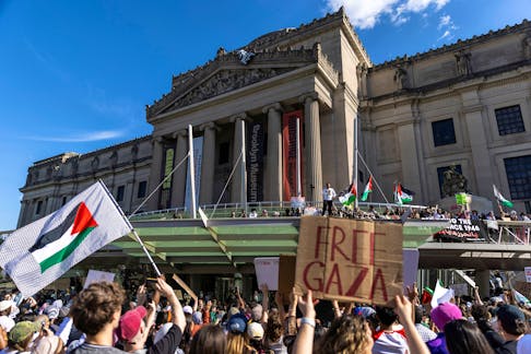 Pro-Palestinian protestors go on top of the Brooklyn Museum entrance roof during a protest, amid the ongoing conflict between Israel and the Palestinian Islamist group Hamas in Gaza, in the Brooklyn borough of New York City, U.S., May 31, 2024.  