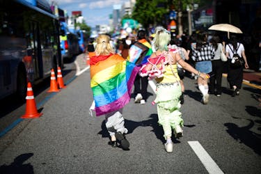 Participants run during the Seoul Queer Culture Festival in Seoul, South Korea, June 1, 2024.  