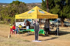 Supporters of the African National Congress (ANC) sit near a cut-out of ANC President Cyril Ramaphosa next to a campaign tent, on the day of the South African elections at Mahlanhle Primary School in Ga Mahlanhle, Limpopo Province, South Africa, May 29, 2024.