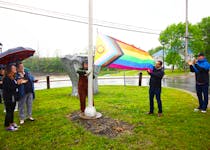 West Hants Mayor Abraham Zebian, second right, and Abigail O’Brien had the honours of hoisting the region’s Pride flag on May 30 to kick off a month-long celebration of the 2SLGBTQI+ community. The flag is located along Windsor’s waterfront. Also pictured are, Angela Grant and Lilly Ashdown, under the umbrella, and Mark Phillips, far right, the municipality’s chief administrative officer.