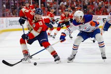Florida Panthers forward Matthew Tkachuk carries the puck through centre ice as the Edmonton Oilers' Philip Broberg defends during Game 2 of the Stanley Cup Final in Sunrise, Fla., on Monday, June 10. Florida went on to win 4-1 and lead the best-of-seven series 2-0 heading back to Edmonton for Games 3 and 4.