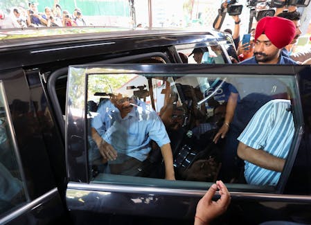 Delhi Chief Minister Arvind Kejriwal gets into his car as he leaves to surrender himself to jail authorities, after interim bail granted by the Supreme Court in a liquor policy case came to an end, in New Delhi, India, June 2, 2024.