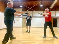 The Forge: Western Martial Arts co-founder and instructor Mark Winkelman, centre, watches as students John Petrie, left, and Derek Stewart practise during a class in Sydney. Chris Connors/Cape Breton Post