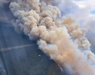 The out-of-control fire that has forced the evacuation of Churchill Falls has jumped the Churchill River seven kilometres west of the town. This photo was taken around 4 p.m. on Tuesday, June 25.  Contributed/ Department of Fisheries, Forestry and Agriculture