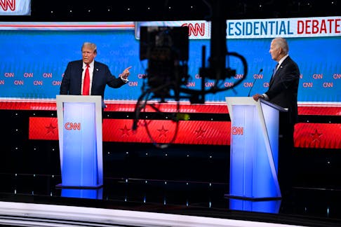 
          Former President Donald Trump and President Joe Biden listen to the moderators during the first 2024 presidential election debate at CNN's headquarters in Atlanta on Thursday, June 27, 2024. The CNN presidential debate kept the volume down, for a change. That didn't make it more intelligible.  (Kenny Holston/The New York Times)
        