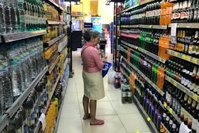 A costumer looks for drinks at a supermarket in Rio de Janeiro, Brazil May 10, 2019.