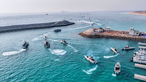 Islamic Revolutionary Guard Corps (IRGC) Navy's speedboats move during an exercise in Abu Musa Island, in this picture obtained on August 2, 2023. IRGC/WANA (West Asia News Agency)/Handout via