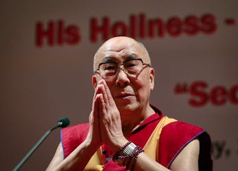 Exiled Tibetan spiritual leader the Dalai Lama gestures during a speech at the 108th anniversary of Indian Merchant Chambers in Mumbai September 18, 2014.