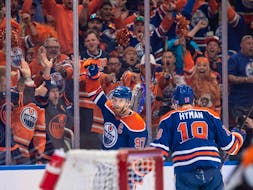  Connor McDavid (97) and Zach Hyman (18) of the Edmonton Oilers, celebrate a first period goal against the Dallas Stars at Rogers Place in Edmonton on June 2, 2024.
