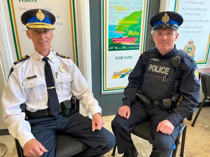 Cape Breton Regional Police Chief Robert Walsh, left, visits Const. James Fitzgerald at the downtown Sydney community office on Charlotte Street. BARB SWEET/CAPE BRETON POST