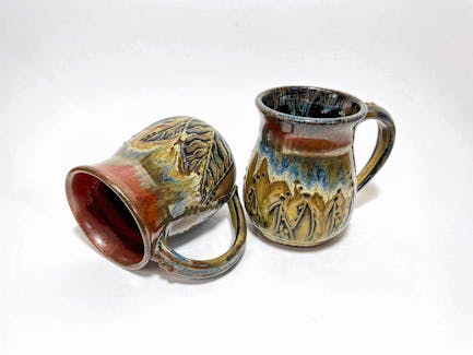 Susan Davar loves it when people picks up one mug after another to see which one speaks to them before their purchase.