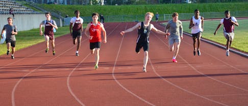 Jaycob Frank, Lane 4, of Bluefield High School in Hampshire won the senior boys’ 100-metre final race at the P.E.I. School Athletic Association (PEISAA) track and field championships at UPEI in Charlottetown on May 31. Frank, who had a time of 11.69 seconds, edged out Charlottetown Rural’s Gabe Ing, Lane 5, at the finish line. For more photos of the PEISAA track and field championships, see pages A4 and B1. Jason Simmonds • The Guardian