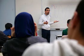 Teacher Ilyas Laarej speaks in front of middle school students during an Islamic ethics class at the Averroes school, France's biggest Muslim educational institution that has lost its state funding on grounds of administrative failures and questionable teaching practises, in Lille, France, March 19, 2024.