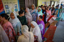 Voters stand in a queue to cast their votes at a polling station during the seventh and last phase of the general election, at a village in Firozpur district, Punjab, India, June 1, 2024.