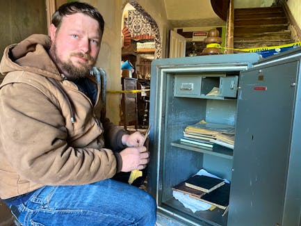 A year after discovering a safe wedged in the floor of the former Notre Dame du Mont Carmel presbytery, stonemason Dean MacArthur finally has it open thanks to a little help from a Winnipeg safe cracker. – Kristin Gardiner/SaltWire
