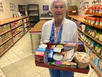 Doris Walton, founder of After the School Bell Food Program, with one of the 176 trays of food that will go out to Cumberland County students facing food insecurity to get them through next weekend.