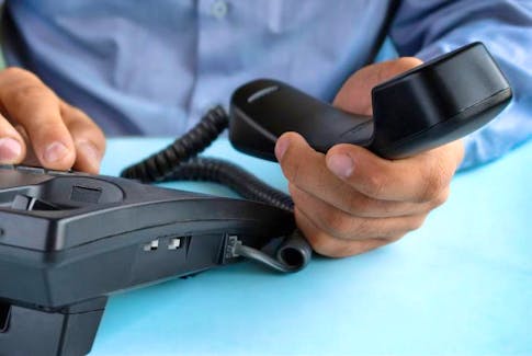 Halifax Regional Police say a phone scam that took place in May involved a suspect who posed themselves as a bank employee and stole credit cards from the victim. - Stock Image