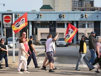 Members of the Public Service Alliance of Canada and the Customs and Immigration Union who work at Canada Border Services and supporters participate in a rally at the Detroit-Windsor tunnel in Windsor on Monday, May 13, 2024.