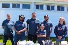 Volunteers for Souls Harbour Rescue Mission working from the organization's food truck to put on a free community barbecue on Saturday. From left, Terry Dwyer, Jason McCready, Augusto Rubio, Ben Dwyer, Ethan Hersey and Holly Dwyer. LUKE DYMENT/CAPE BRETON POST