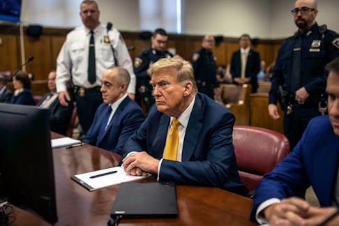 
          Former President Donald Trump, the presumptive Republican nominee for president, during his criminal  trial on 34 counts of falsifying business records in New York on May 21, 2024. Manhattan prosecutors on Tuesday, July 2, 2024,  agreed with Trump's request to postpone his criminal sentencing so that the judge overseeing the case could weigh whether a recent U.S. Supreme Court ruling might imperil his conviction, new court filings show. (Dave Sanders/The New York Times)
        