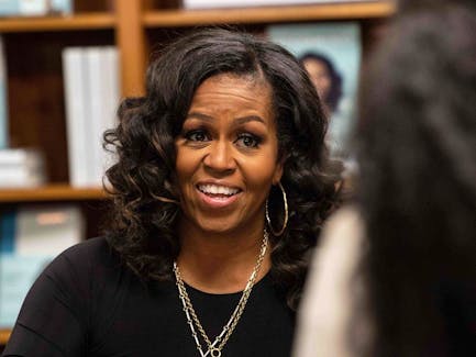 U.S. First Lady Michelle Obama meets with fans during a book signing on the first anniversary of the launch of her memoir "Becoming" at the Politics and Prose bookstore in Washington, DC, on November 18, 2019. 