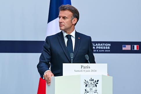 FILE — President Emmanuel Macron of France speaks to reporters in Paris, June 8, 2024. The National Rally party on Sunday, June 30, won a crushing victory in the first round of voting for the French National Assembly, according to early projections, bringing its long-taboo brand of nationalist and anti-immigrant politics to the threshold of power for the first time. (Kenny Holston/The New York Times)  -