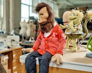 
          A Muppet version of the puppeteer Jim Henson at his Creature Shop in Queens on May 21, 2024. The workshop still cranks out characters more than three decades after Henson's death. (Thomas Prior/The New York Times)
        