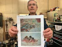 Louis Wamboldt in his garage with photos of the A. Crassus parasite he's found in the swim bladder of American eels.