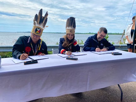On July 4, Chief Junior Gould, left, Chief Darlene Bernard and Minister Steven Guilbeault signed an agreement to establish Pituamkek, off Lennox Island, as Canada's 48th national park. – Kristin Gardiner, SaltWire