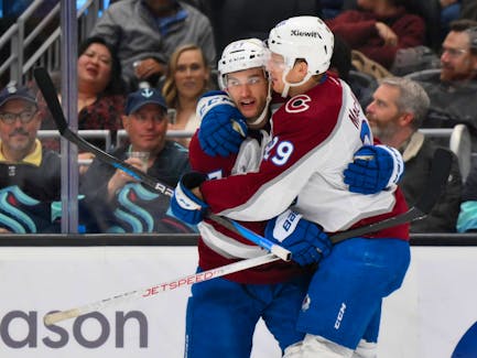 Former Halifax Mooseheads linemates Jonathan Drouin, left, and Nathan MacKinnon celebrate a goal with the Colorado Avalanche during a Nov. 13, 2023 game against the Seattle Kraken. - Steven Bisig-USA TODAY Sports