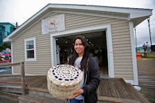 Jade Sark displays one of her black ash baskets at the Sipekne' katik Treaty Truckhouse in Halifax Friday July 5, 2024.